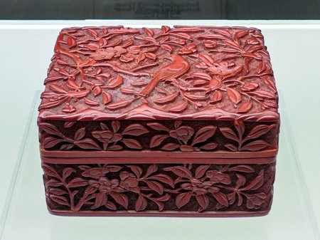 Cake made of red clay with floral pattern, closeup of photoの写真素材