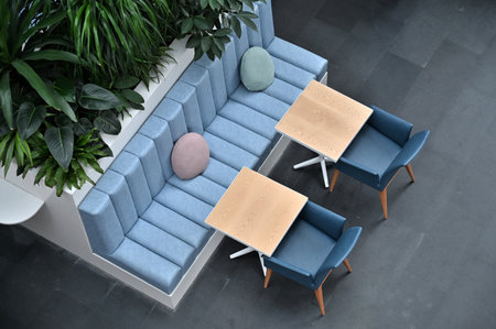 Interior design of modern cafe with blue sofa, table and chairsの写真素材