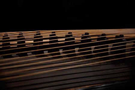 Close-up of the strings of a grand piano on a black backgroundの写真素材