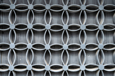 Metal lattice pattern on the wall of the building, Thailand.の写真素材