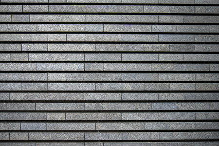 Background of gray brick wall texture. Wall of gray brick wall.の写真素材