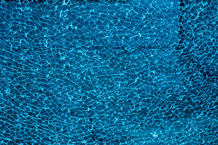 abstract blue water texture with some smooth lines in it and some spots on it