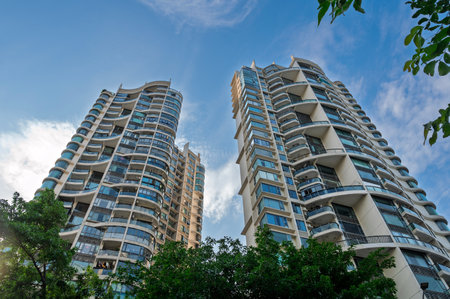 Modern apartment buildings on blue sky background in Shenzhen, China.