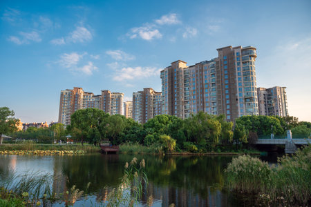 Residential buildings on the bank of the river in the evening.の写真素材
