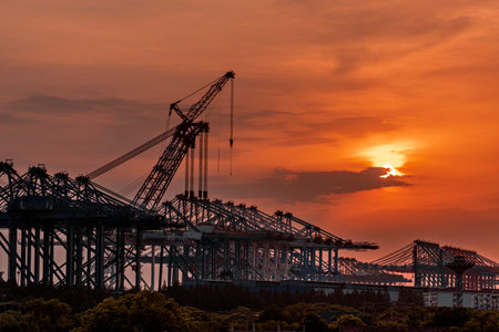 Silhouette of cranes at sunset in the port of Lisbon, Portugal