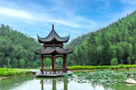 Wooden pavilion on the lake in the park, China.の写真素材