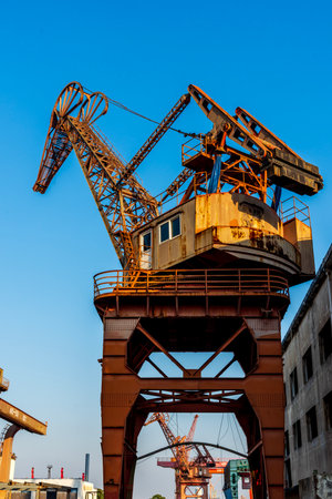 Old crane in the port of Bangkok, Thailand. Industrial landscape.の写真素材