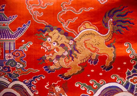 The texture of the fabric is red with a paisley pattern.
