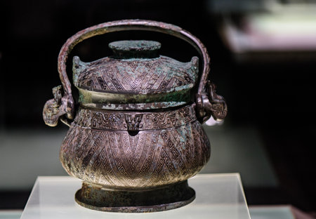Chinese ancient bronze teapot in the museum, closeup of photoの写真素材