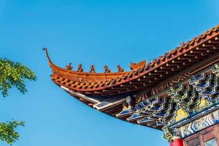Roof of chinese temple with blue sky background, Thailand.