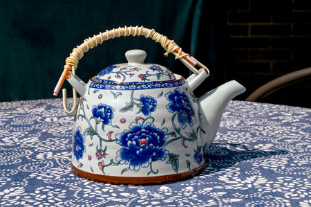 Teapot on a table in a restaurant, close-upの写真素材