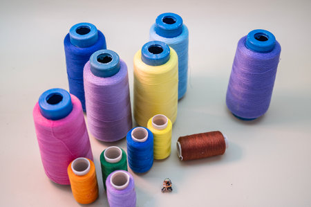 spools of thread on a white background. multi-colored threads