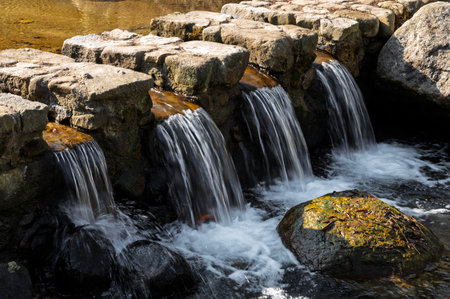 Waterfall in the park. Waterfalls in the park. Spring