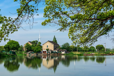 Scenery view of the lake and the old house in the countrysideの写真素材