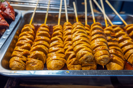 Sausage on skewers in a street food market in Thailand