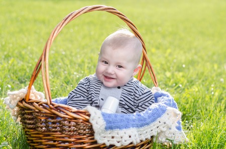 baby resting in a wicker basket