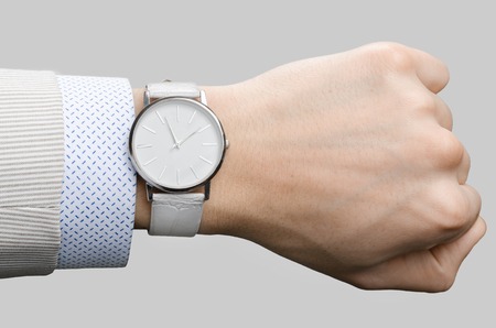 stylish white wristwatches on the hand businessmanの写真素材