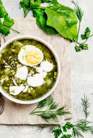 Traditional Russian soup with sorrel, meat and eggs, called green borsch, top view