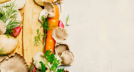 Food background, fresh vegetables, mushrooms and herbs, ingredients for soup making, top viewの写真素材
