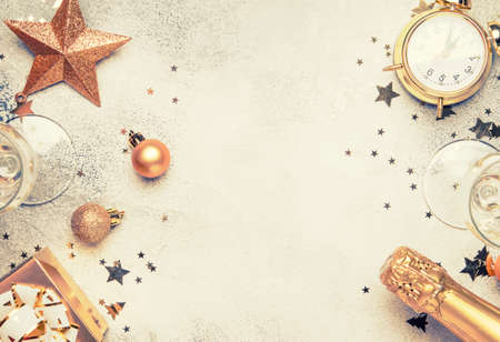 Christmas or New Year composition, frame, gray background with gold Christmas decorations, stars,...