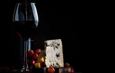 Port wine and blue cheese, still life in rustic style, vintage wooden table background, selective focusの写真素材