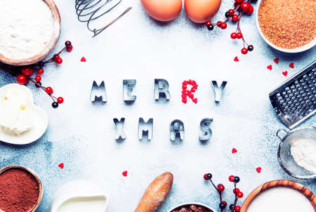 Christmas or New Year composition with ingredients for baking or cookies, with golden snowflakes,...