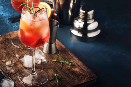 Milano  italian alcoholic cocktail with red bitter, dry white wine, soda, zest and ice. Blue...
