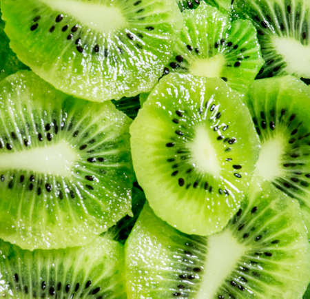 Green kiwi food background, top viewの写真素材