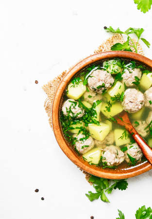 Soup with chicken meatballs, white background, top viewの写真素材
