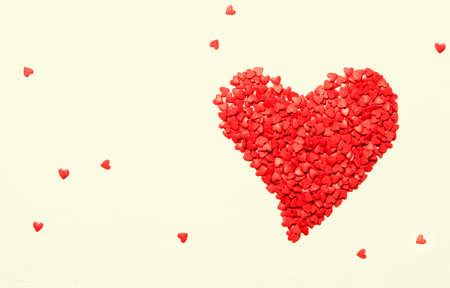 Red heart from sweet sugar hearts, Valentine's Day card, light background, top viewの写真素材