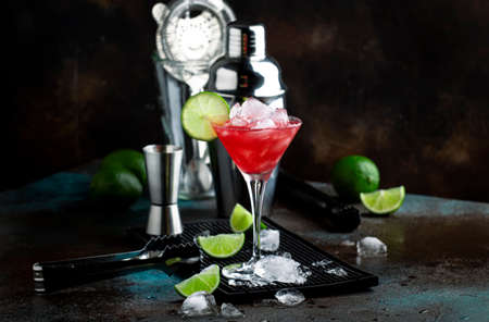 Summer cold drink with watermelon, mint and lime on black background. Copy space