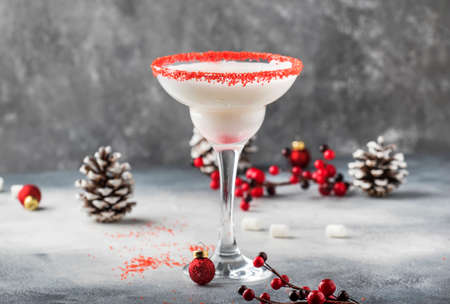 Snow daiquiri, Christmas or New Year alcoholic cocktail with rum and cream with red decor in festive setting, copy spaceの写真素材