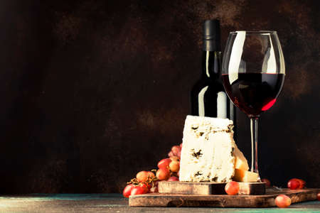 Port wine and blue cheese, still life in rustic style, vintage wooden table background, selective focusの写真素材