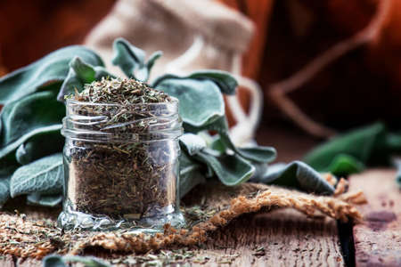 Dried and fresh sage, rustic style, vintage wooden background, selective focusの写真素材