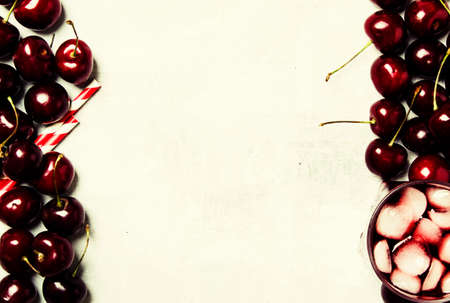 Cold cherry juice with ice, top viewの写真素材