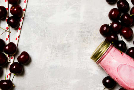 Cherry milkshake with berries, food background, top viewの写真素材