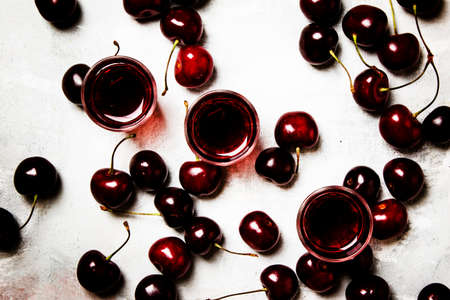 Strong drink, sweet cherry liqueur and black cherries, top viewの写真素材