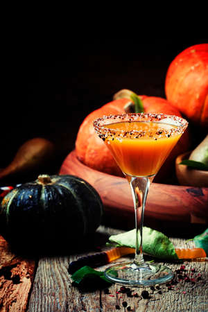 Halloween orange cocktail on a dark festive background, selective focusの写真素材