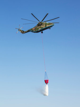ROSTOV-ON-DON, RUSSIA - JULY 01: Mi-26T heavy transport helicopter, fire extinguishingのeditorial素材