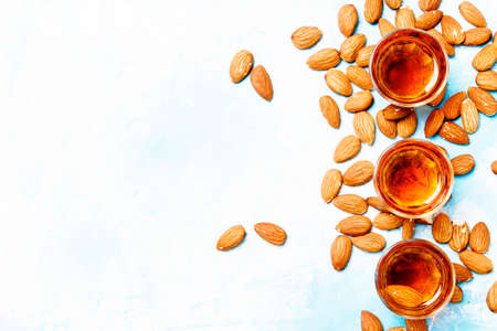 Strong alcoholic drink with almonds, top viewの写真素材