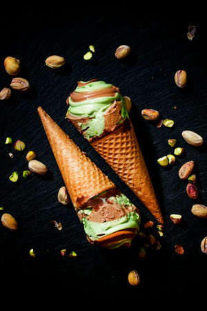 Two cone of pistachio ice cream, food background, top view