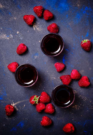 Homemade raspberry liqueur, food background, top viewの写真素材