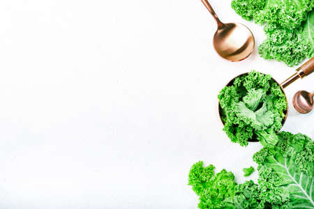 Kale cabbage. Green vegetable leaves, top view on white background, healthy eating, vegetarian food