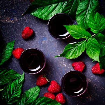 Raspberry drink, black background, top viewの写真素材