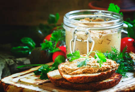 Sandwiches with liver pate on the cutting board, selective focus