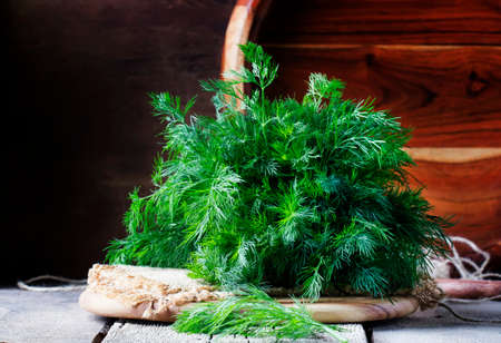 Fresh dill on the old wooden table, rustic style, selective focusの写真素材