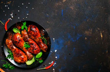 Baked chicken legs in sauce with honey and balsamic vinegar, top viewの写真素材