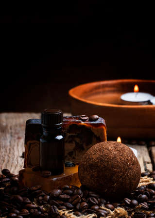 Coffee spa: soap, oil, salt, candles. Vintage wood background, selective focusの写真素材