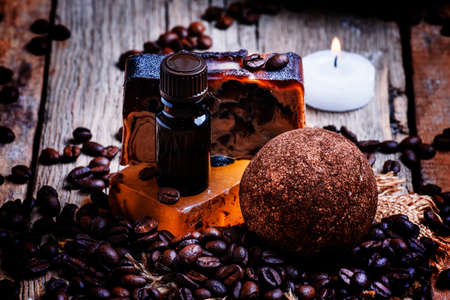 Coffee spa: soap, oil, salt, candles. Vintage wood background, selective focusの写真素材