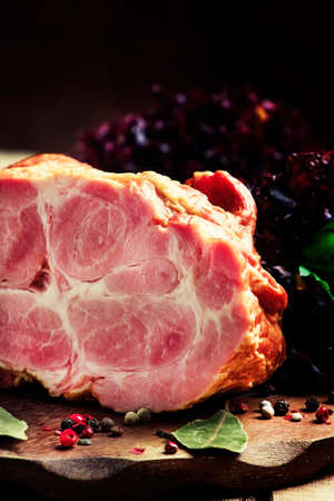 Smoked pork, old wooden background, selective focusの写真素材